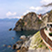 On the path ahead we can see the next village, Manarola.  Trains move through the mountain tunnels, stop at each village, and reach the rest of the coast of Italy.