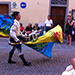 A traditional procession with Renaissance band and flag jugglers.